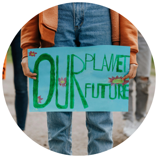 group of climate activists holding signs. It says Our Planet Our Future