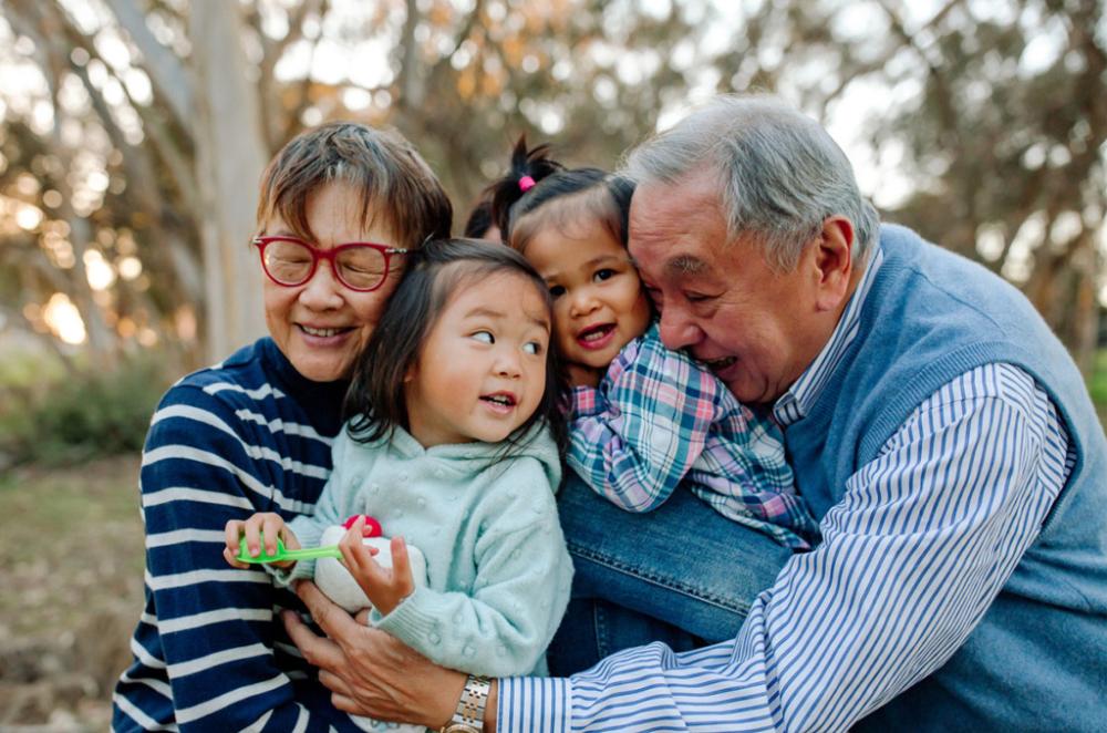 Grandparents and grant children in a warm embrace