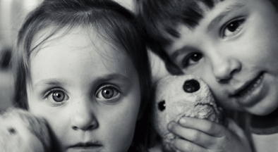 Boy and Girl with their stuffed toys.