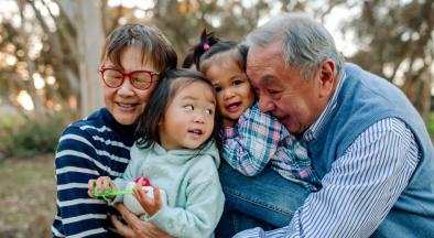 Grandparents and Grandchildren sharing a warm happy embrace.